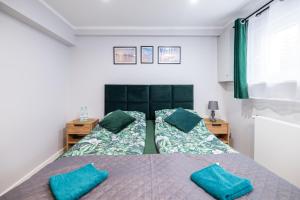 Posteľ alebo postele v izbe v ubytovaní Apartamenty Jelitkowska 13,Gdańsk Jelitkowo, 100m od morza