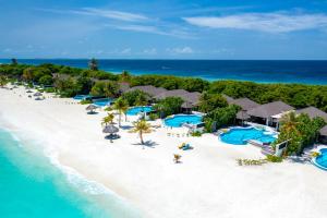 an aerial view of a resort on the beach at Atmosphere Kanifushi - Premium All Inclusive with Free Transfers in Lhaviyani Atoll