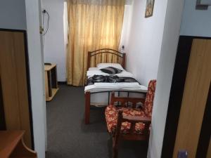 Postel nebo postele na pokoji v ubytování Happy inn