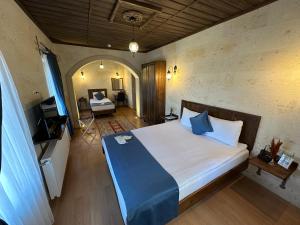 Postel nebo postele na pokoji v ubytování Virtus Cappadocia Hotel Göreme