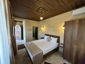 Postel nebo postele na pokoji v ubytování Virtus Cappadocia Hotel Göreme