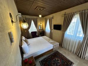 Postel nebo postele na pokoji v ubytování Virtus Cappadocia Hotel Göreme