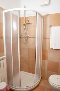 a shower stall in a bathroom with a toilet at Villa Marianna in Vasto