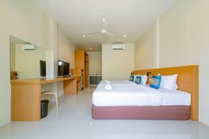 Letto o letti in una camera di Lightplus Khao Lak