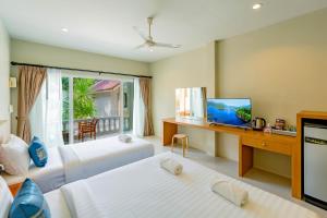 Letto o letti in una camera di Lightplus Khao Lak