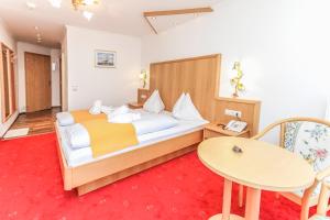 Llit o llits en una habitació de Hotel Tannenberg