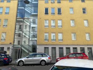 a group of cars parked in front of a building at West2 Apartment in Vienna