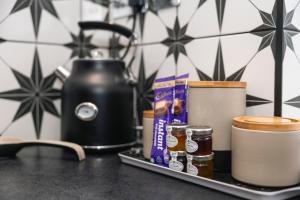 a tray with jams and spices on a counter at The Nook Cottage, Parkgate, Wirral in Parkgate
