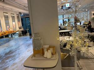 a store with a christmas tree and candles on a table at ypark in Seoul