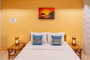 Letto o letti in una camera di Lightplus Khao Lak