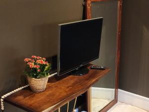 A television and/or entertainment centre at La Casa Rossa - free parking