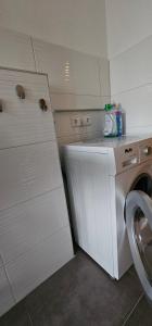 a laundry room with a washer and a washing machine at Monteurwohnung/Ferienwohnung an der Steige in Geislingen an der Steige