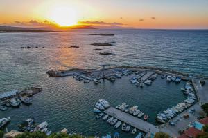 an aerial view of a marina with boats in the water at Chania Flair Boutique Hotel, Tapestry Collection by Hilton in Chania Town