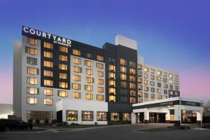 a rendering of a hotel with a building at Courtyard by Marriott Edina Bloomington in Bloomington