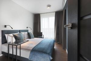 Posteľ alebo postele v izbe v ubytovaní Apartamenty Jozefina