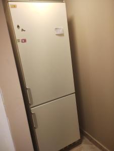 a refrigerator in a kitchen with magnets on it at Freedom Ame 3 in Río Gallegos