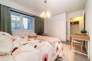 a bedroom with a large bed with a cow blanket at Kitka's Gem, luxurious condo in Kuusamo, Lapland in Kuusamo