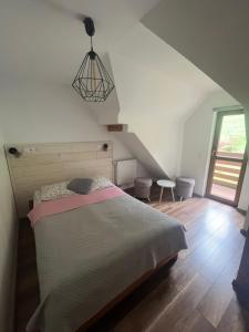 Voodi või voodid majutusasutuse Apartamenty Kadłubek toas