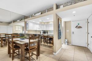 a kitchen and dining room with a table and chairs at East Pass 102 in Destin