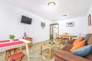 a living room with a couch and a table at Benidorm Old Town 48 Apartment 2-C in Benidorm