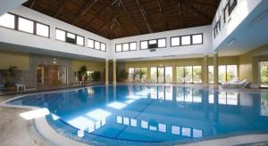 a large swimming pool in a large building at Terrace Flat with Magnificient view in Tavira