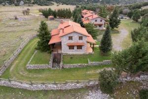 an aerial view of a house with an orange roof at Mont Valley Boutique Chalets in Arachova