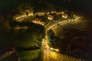an aerial view of a house with lights on it at Mont Valley Boutique Chalets in Arachova