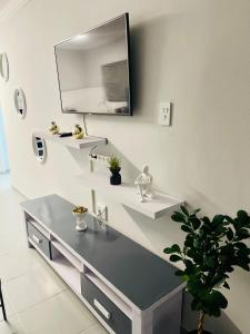 a bathroom with a sink and a mirror at Pelican Apartment in Durban