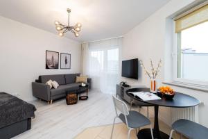 Гостиная зона в Apartament Lothus - parking podziemny gratis, ścisłe centrum - by Kairos Apartments