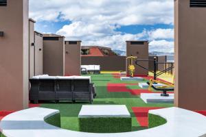 a room with a colorful floor with a playground at Cabrera 85 Apartments in Bogotá
