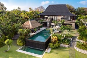 an aerial view of a villa with a swimming pool at Bulgari Resort Bali in Uluwatu