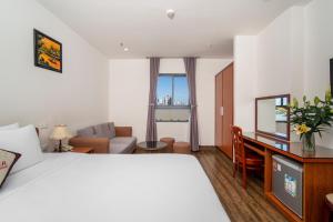 Postel nebo postele na pokoji v ubytování Phú An Hotel + 37 fotografií