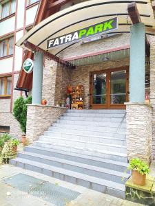 a eatery with stairs in front of a building at Apartmánový dom Fatrapark 1- Ap 318, Ap 306 Mezonet in Ružomberok +123 photos