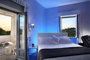La Suite Boutique Hotel客房内的一张或多张床位