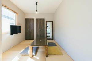 TV a/nebo společenská místnost v ubytování guesthouse SHIBAFU