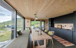 a kitchen and dining room with a table and chairs at Gorgeous Home In Jsenfjorden With Sauna in Gullingen