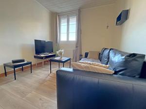 Televízia a/alebo spoločenská miestnosť v ubytovaní Charmant T2 à Berck Plage, proche commerces et plage, avec équipements modernes et cour fleurie - FR-1-646-31