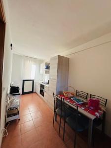a small kitchen with a table and chairs in a room at B&B Panta Rei in Arezzo +7 photos