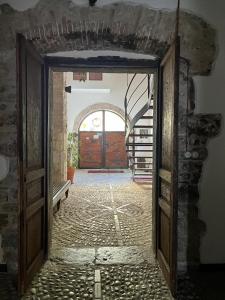 an entrance to a building with an open door at DOMUS VELA in Fornelli