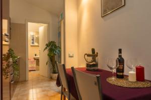 a dining room with a table with wine glasses at Archi di Vesna II in Ancona