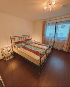 Postel nebo postele na pokoji v ubytování Ferienwohnung in der fränkischen Schweiz