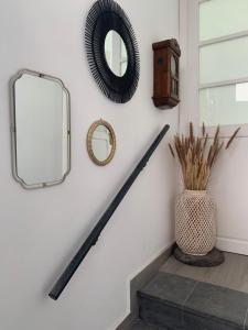 a hallway with a mirror and a vase on the stairs at Meriga in Agulo