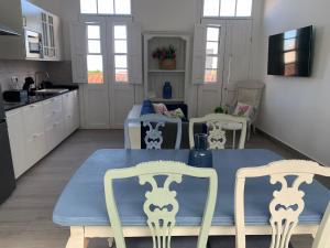 a kitchen with a table and two chairs in a kitchen at Meriga in Agulo