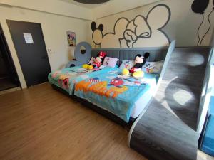 Cama ou camas em um quarto em Wujie Childlike B&B