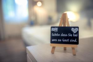 Postel nebo postele na pokoji v ubytování C-YOU Hotel Chemnitz