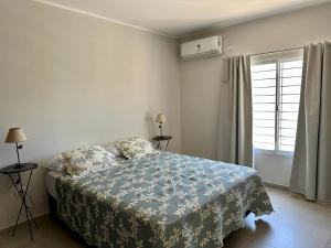 Postel nebo postele na pokoji v ubytování DUPLEX QUICHI