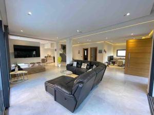 Posezení v ubytování Villa de luxe avec piscine