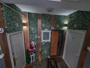 a room with a santa claus on the wall at Apartman Milos free parking in Kraljevo