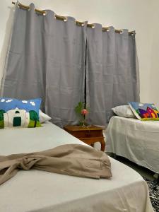 Postel nebo postele na pokoji v ubytování Casa Araújo