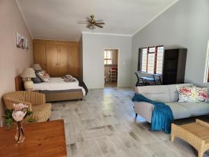 a living room with a couch and a bed at Thys' Place in Cape Town +42 photos
